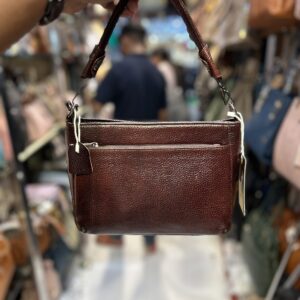 Brown leather sling bag